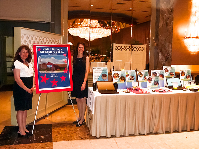 Picture of two women at a conference.
