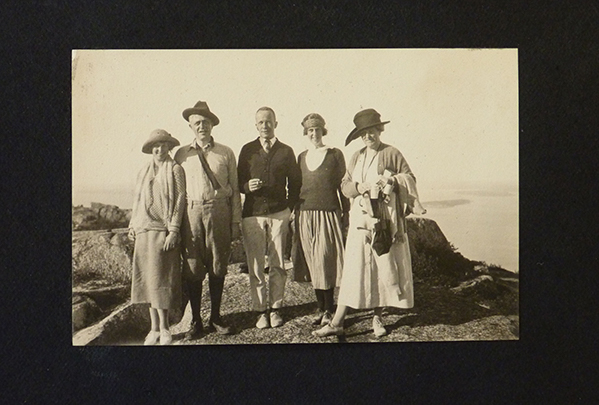 Black and white photo of people on a mountain.